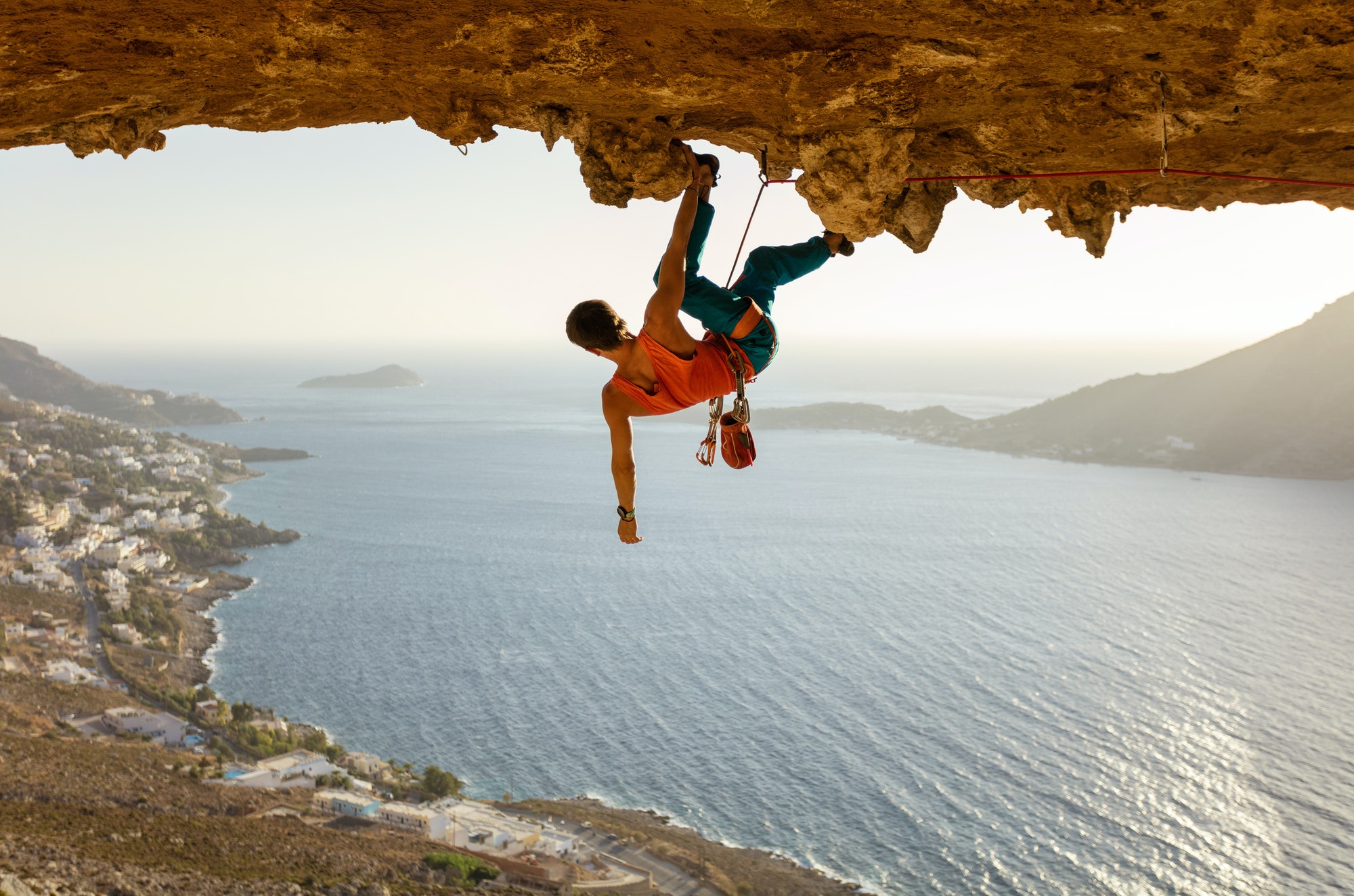 Male rock climber on challenging route
