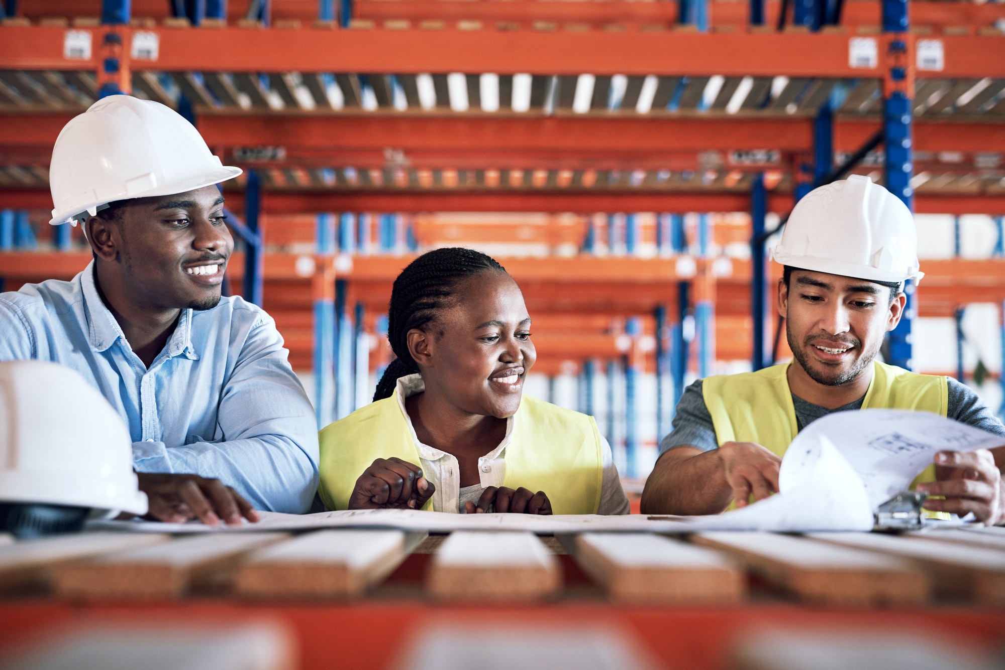 Shot of a group of builders having a meeting at a construction site